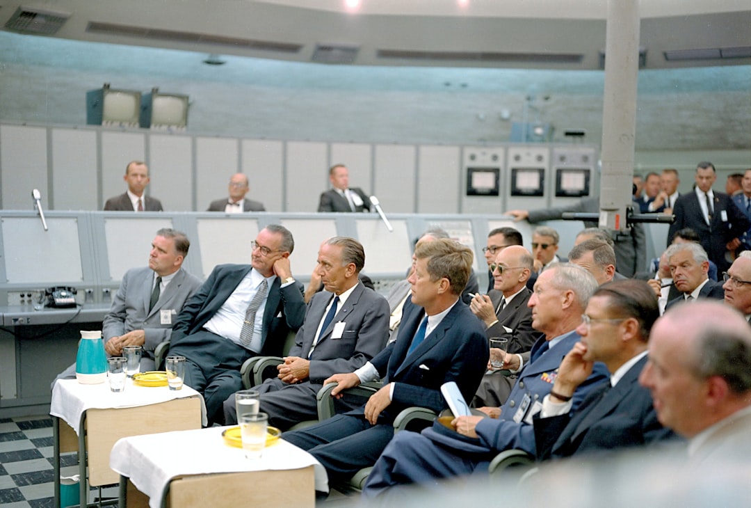 Defense policy meeting with officials reviewing documents