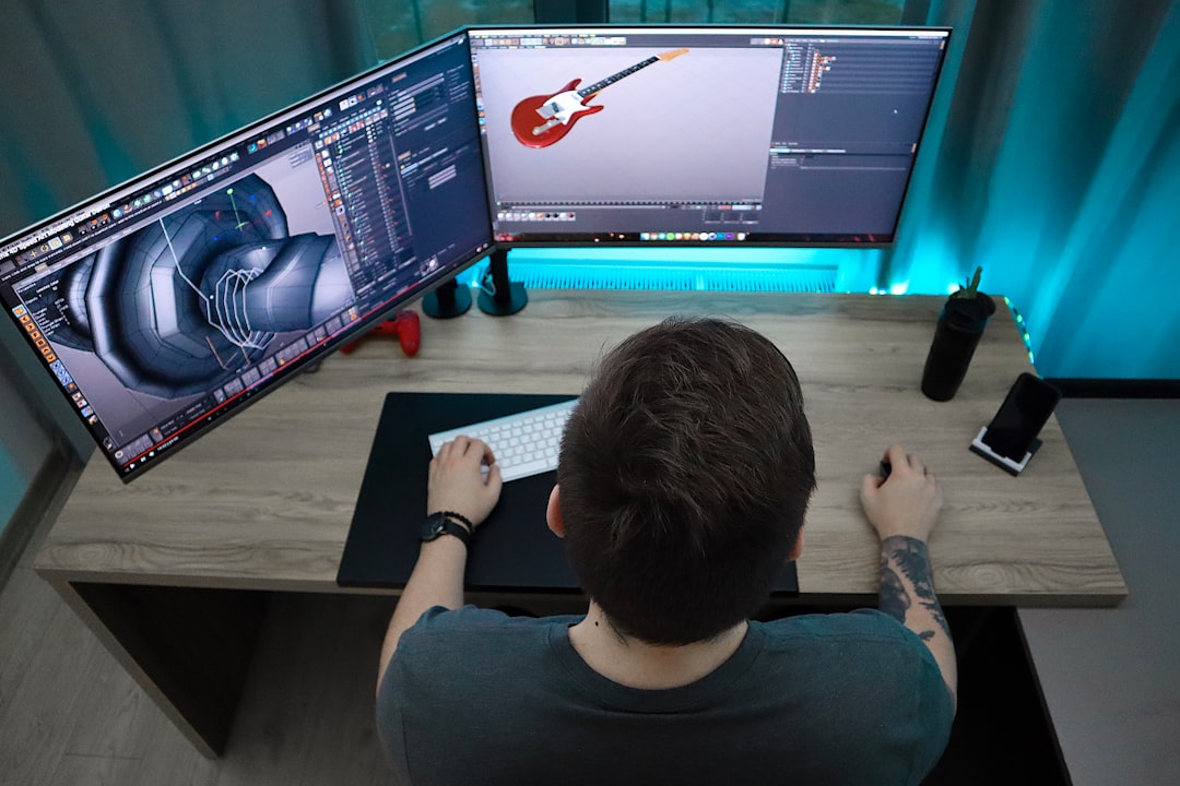 Game studio artists working with 3D modeling software