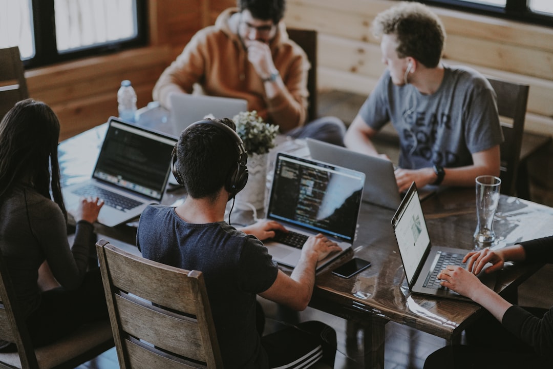 Young Korean startup team collaborating at a tech workspace