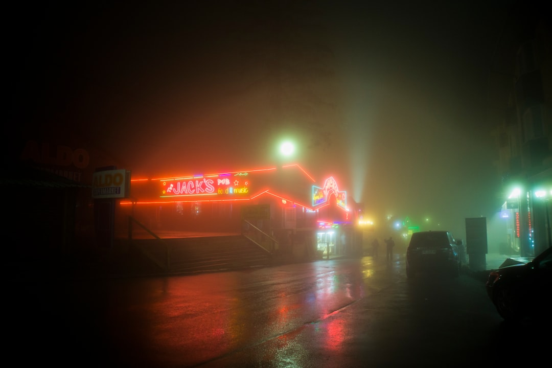 Fire engines at large warehouse complex at night
