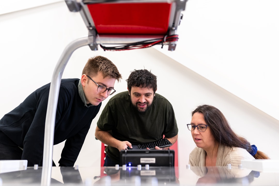 University lab with robotics and students coding