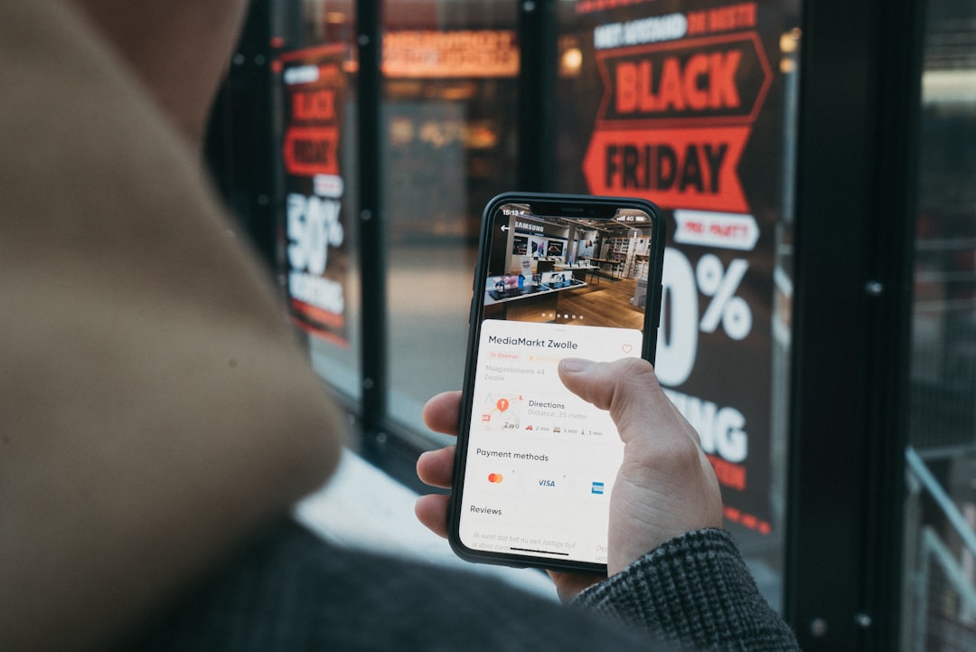 Young seller using smartphone to film products